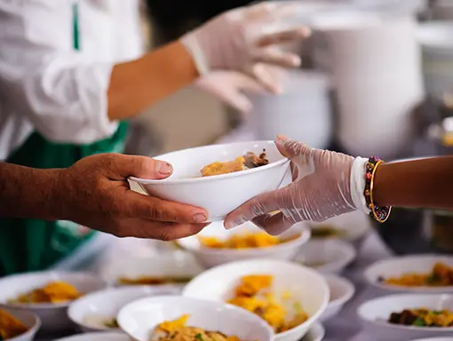 An image of volunteers serving food